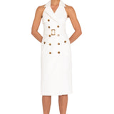 Woman wearing a white trench dress with buttons on a white background
